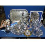 A good quantity of plated items including cruet with blue glass liners, candelabra, tray,