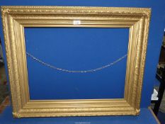 A large gilt picture frame, aperture 24" x 18".