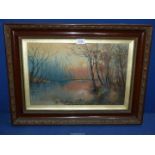 A framed and glazed Oil painting depicting Two figures walking riverside path at sunset,