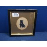 A small framed and circular mounted watercolour of a portrait of a black Labrador, initialled R.A.