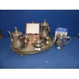 A silver plate coffee and teapot set plus a pewter tankard and cased teaspoons.