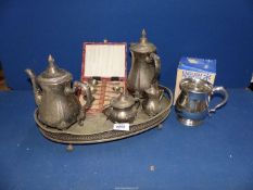 A silver plate coffee and teapot set plus a pewter tankard and cased teaspoons.