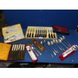 A quantity of cased and loose plated cutlery, cased horn handle steak knives and forks,