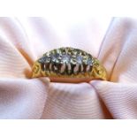 An 18ct gold half Eternity ring with five diamonds, London hallmark, size 'O', 3.13 gm.