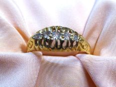 An 18ct gold half Eternity ring with five diamonds, London hallmark, size 'O', 3.13 gm.