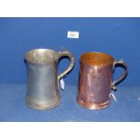 A Georgian quart copper and brass Tankard and an early regency Pewter quart Tankard,