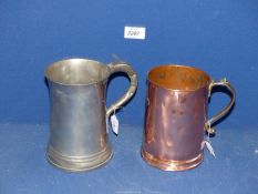 A Georgian quart copper and brass Tankard and an early regency Pewter quart Tankard,