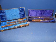 Two cased carving sets with horn handles, cases a/f.