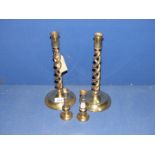 Two pairs of brass candlesticks, one being barley twist.