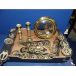 A quantity of brass including a pair of candlesticks [one pusher missing] martingales and a convex
