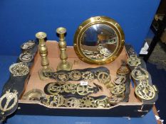 A quantity of brass including a pair of candlesticks [one pusher missing] martingales and a convex