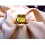 An unmarked Engagement ring with large square cut yellow stone (tourmaline ?),