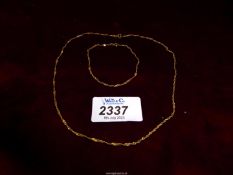 A 9ct gold twist rope chain necklace, 1.67 gm. and a matching bracelet, 0.78 gm.