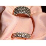 Two stamped 'silver' Keeper rings, one with two braid band, other with four braid,