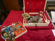 A quantity of costume jewellery in jewellery boxes including vintage beads, brooches etc.