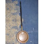 A copper Warming pan.