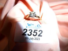 An 18ct gold solitaire 1/10 diamond ring, size L, overall weight 2. 89 gms.