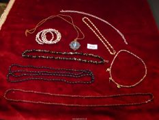 A quantity of necklaces and bracelets including a baroque pearl bracelet,