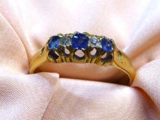 An 18ct gold set Engagement ring with three sapphires alternated between two diamonds,
