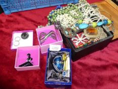 A black oriental style jewellery box and contents of costume jewellery, cuff bangle,
