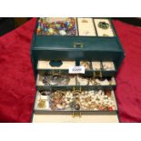 A jewellery box and contents of costume jewellery earrings, beads, chains, rings etc.
