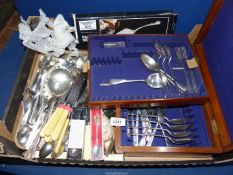 A quantity of cutlery including sugar tongs, knives ,forks and spoons, etc.