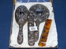 A Silver dressing table set comprising hairbrush, comb, clothes brush and mirror, Birmingham 1970,