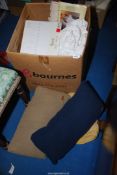 A box of cushions and bed linen including Harrods, Marco Polo, etc.