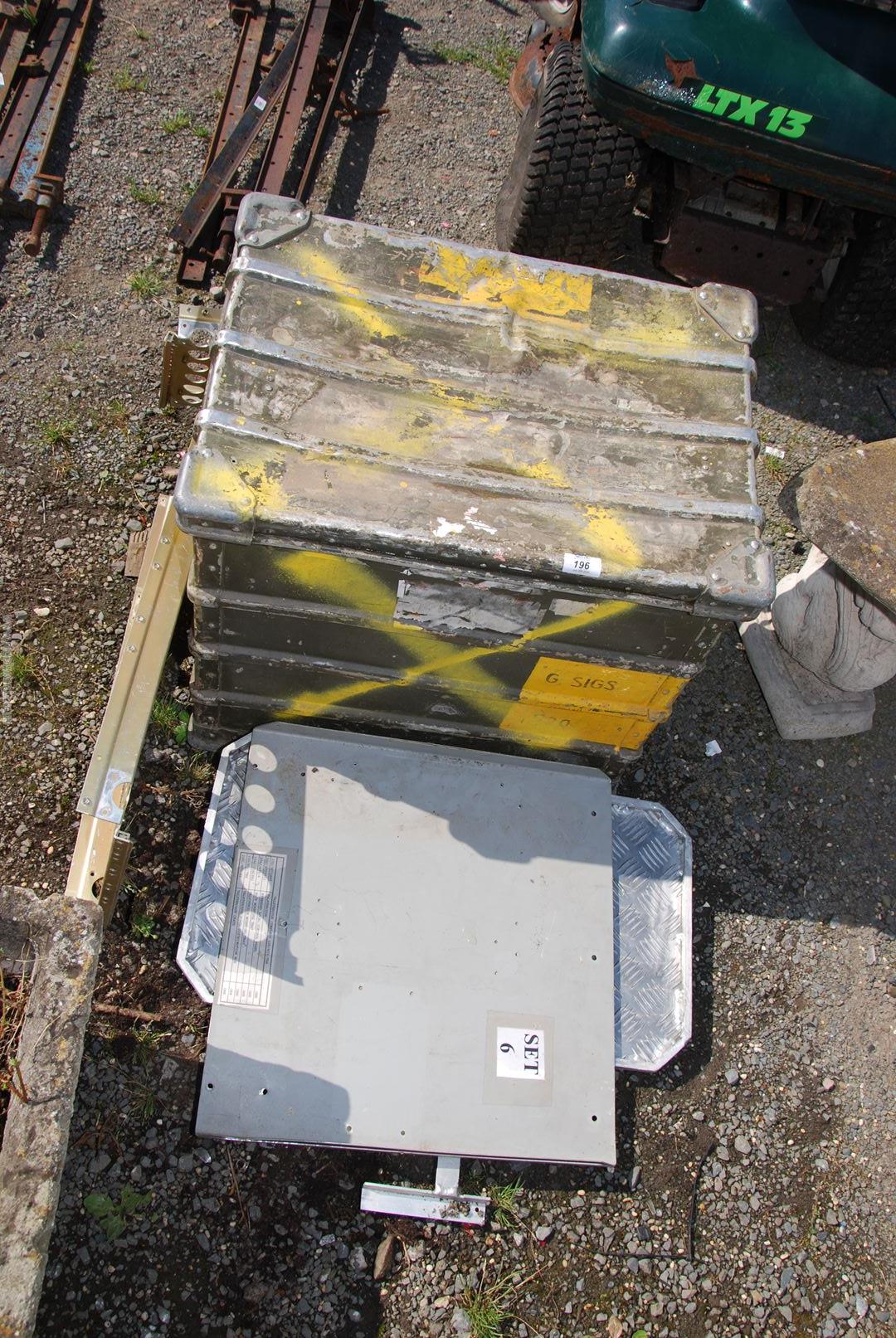 An aluminium storage trunk and a quantity of shelving.