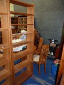 A light Oak set of floor standing Bookshelves two fixed and four adjustable, 24" wide,