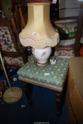 A table lamp and a stool.
