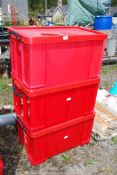 Three red plastic storage boxes 17" x 27" x 14 1/2" high.