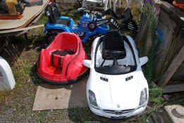 A child's ride on tractor, Mercedes and Dodgem car.