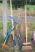 Large quantity of garden tools - forks, shovel, loppers, brushes, saw, etc.