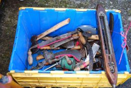 Box of tools: oil can, draw plane, meat cleaves, small hatchet, grass hooks, meat mincer, etc.