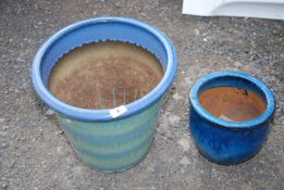 Two glazed pots; one at 13" x 14 1/2", the other 7 1/2" x 9 1/2".