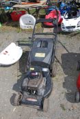 A 'Lawn King' propelled mower with Briggs & Stratton engine - engine turns.