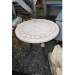 A garden table with tiled top