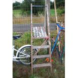 Four rung wooden step ladder.