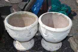 A pair of large concrete planters (one cracked), 18 1/2'' diameter x 19'' high.
