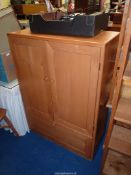 A light oak Music centre Cupboard, made by Grahame Amey,