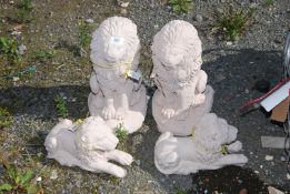 Three concrete Lion garden figures.