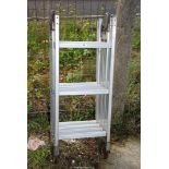 Folding twelve rung aluminium ladder.