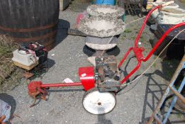 A rotavator with a Briggs & Stratton engine - for spares or repairs.
