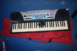 A Danmark Yamaha PSR-170 keyboard and two stands.