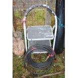 Two rung step ladder & a roll of armoured cable.