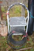 Two rung step ladder & a roll of armoured cable.