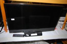 A Samsung flatscreen TV, 31'' screen, with remote.