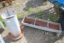 A galvanised trough, 35" long x 10" wide and a chicken feeder.