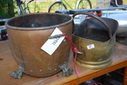 A copper coal bin and a brass helmet coal scuttle.